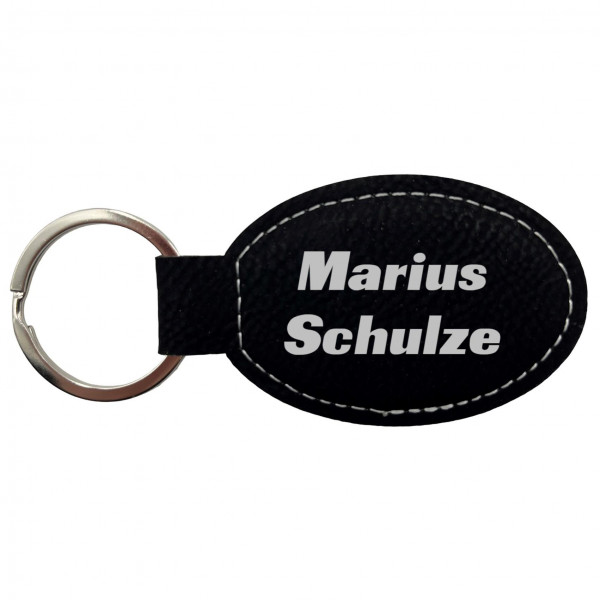 Schlüsselanhänger Kunstleder oval schwarz personalisierbar in silber